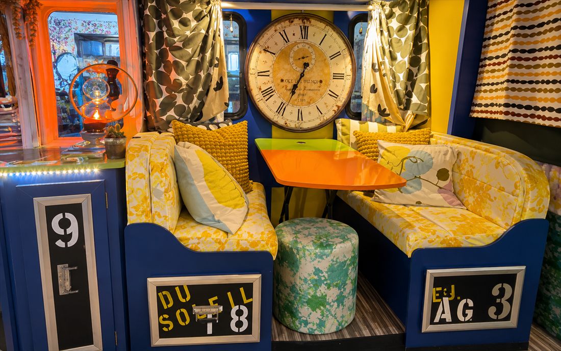BigTopHop dinette beneath a large vintage clock