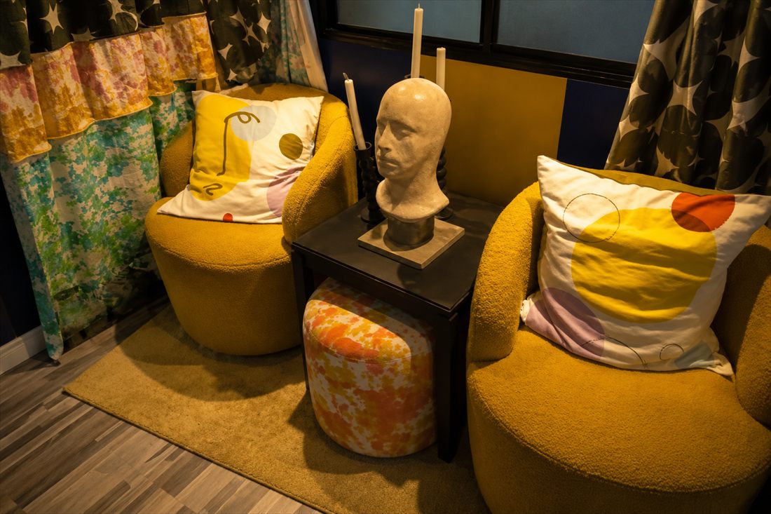 BigTopHop lounge with rounded mustard armchairs