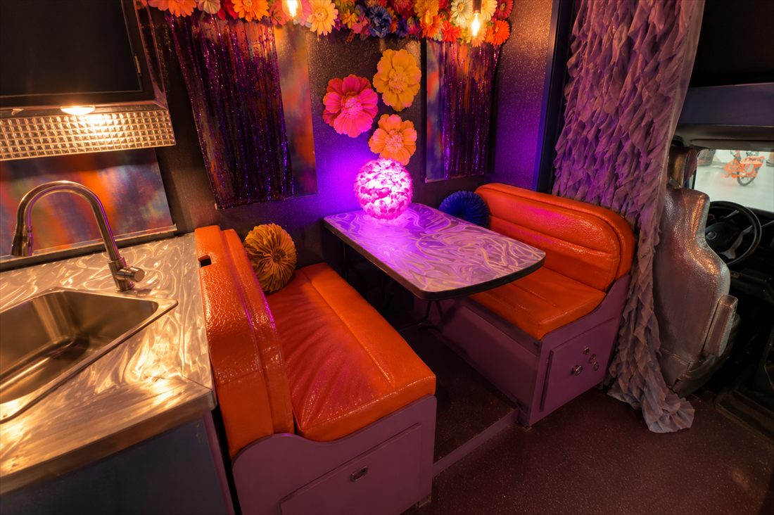 LoveRocket diner booth with its glowing orb centerpiece