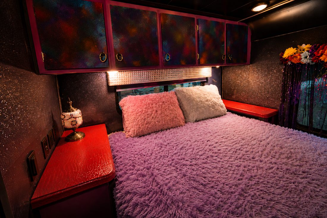 LoveRocket bedroom with glitter walls and plush bedding