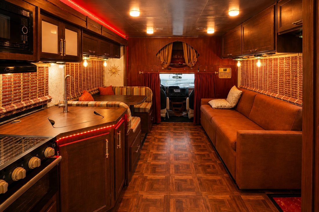 Stiggypop galley and lounge in warm amber light
